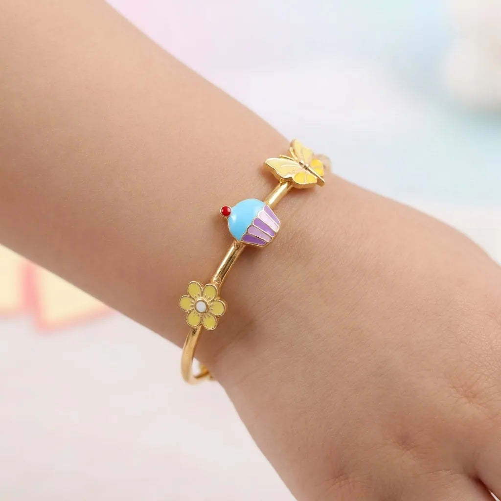 Silver Sweet Bloom Silver Kada – Flower, Cupcake & Butterfly – Product shown on a child’s wrist