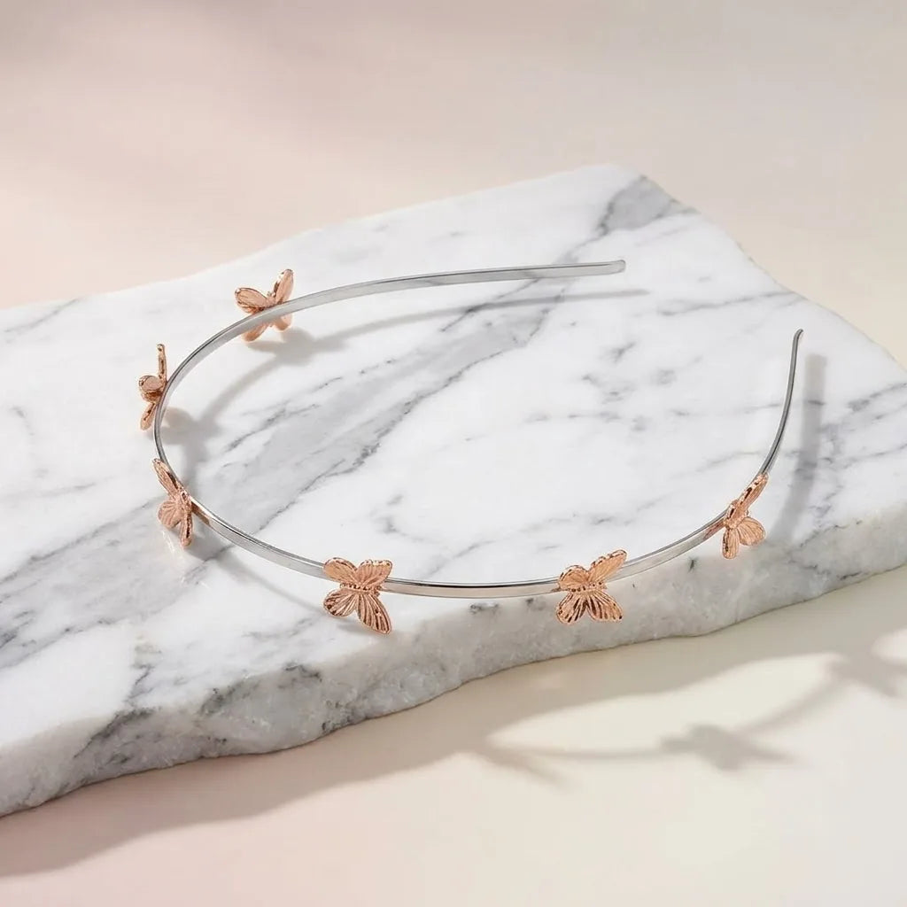 Silver Butterfly Hair Band — Thematic Still Life