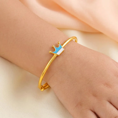 Silver Royal Crown Silver Kada – Blue Enamel Charm – Product shown on a child’s wrist